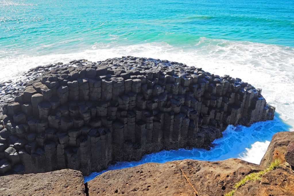 The Giant's Causeway is a formation of interlocking hexagonal volcanic rock pillars