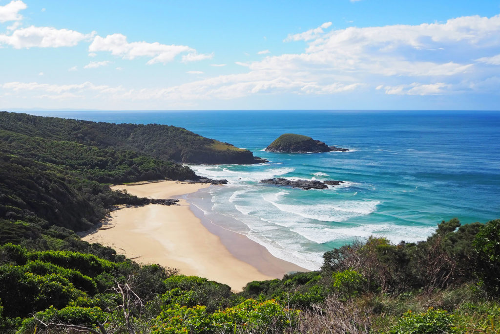 View over the secluded North Smokey Beach and Green Island from Captain Cook's Lookout